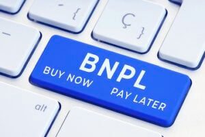 Letters "BNPL" on the return key of a keyboard