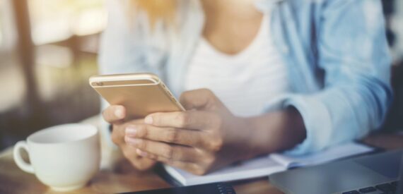 Female hands holding a smartphone