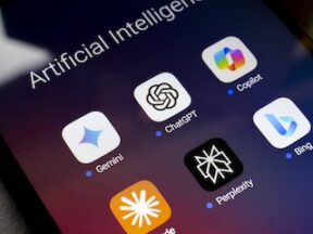 The Google Gemini, ChatGPT, Microsoft Copilot, Claude by Anthropic, Perplexity and Bing apps logos is displayed on the screen of a smartphone